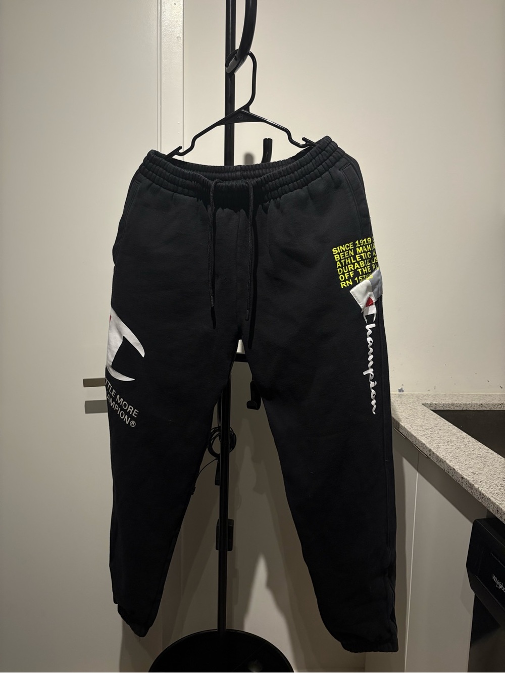 Champion Black Joggers with White Logo and Yellow Accent Text